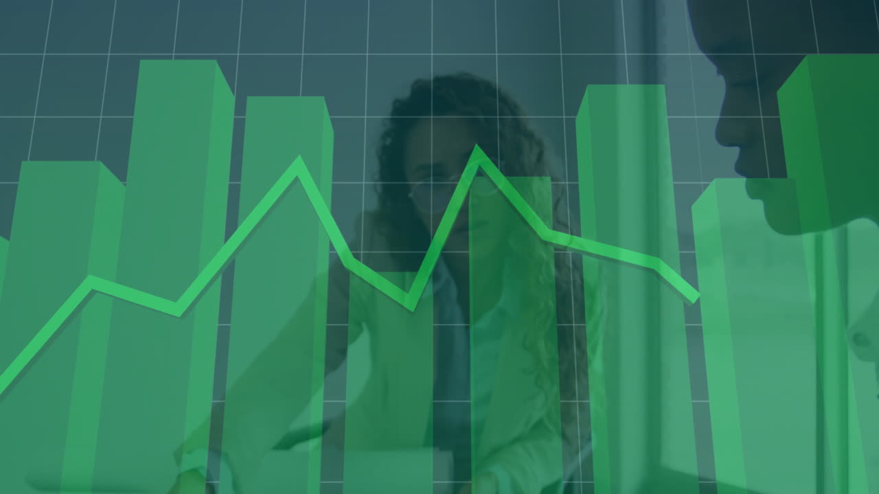 Green financial graph animation over business professionals discussing in office
