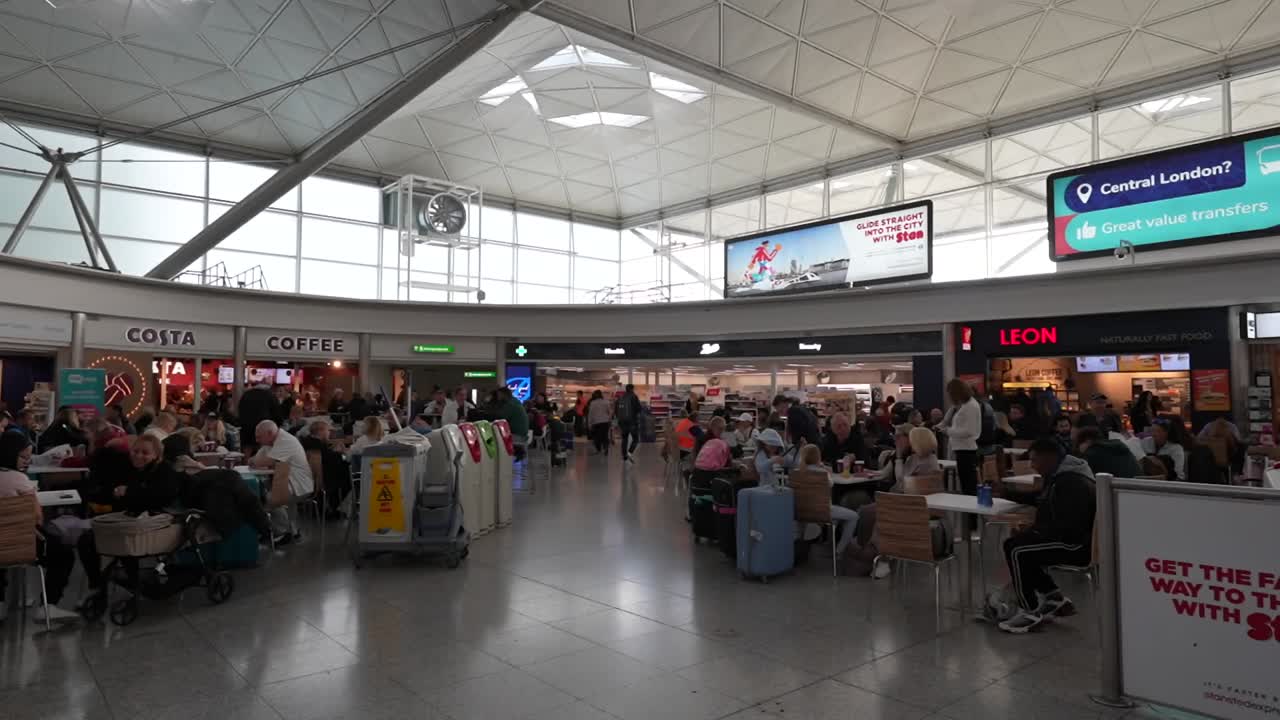 Grabbing a bite and coffee at Stansted Airport arrivals area, London