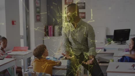 animation of networks over happy african american male teacher talking to pupils in class