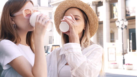 two friends enjoying coffee outdoors