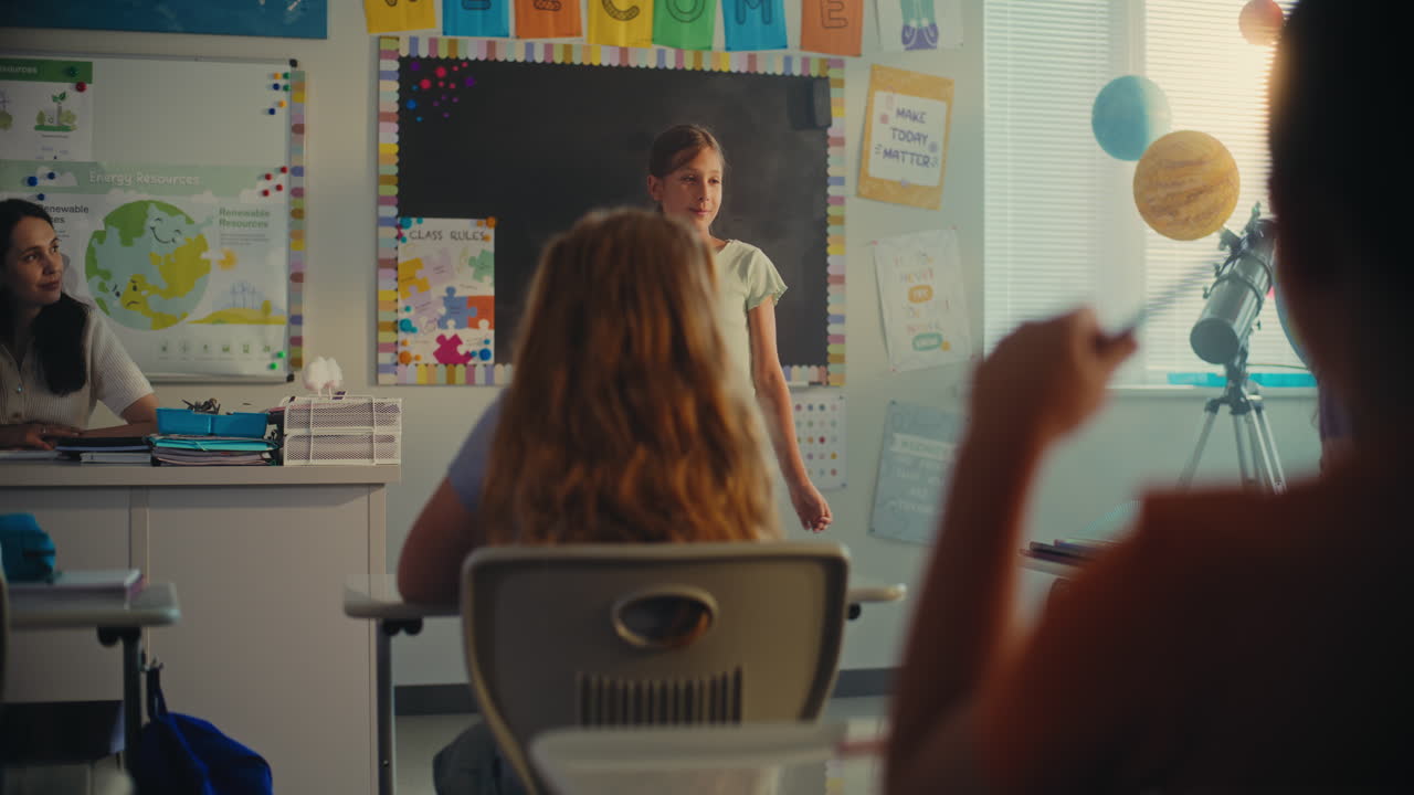 Elementary School Girl Presenting Homework on Ecology in Front of Classmates and Teacher