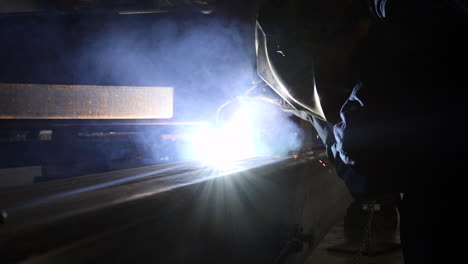 a welder at work in slow motion