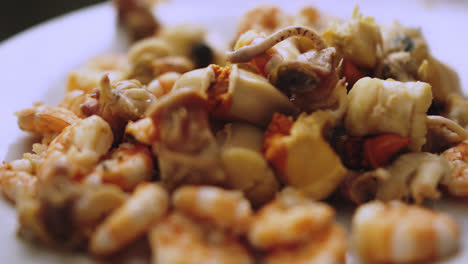 close-up of shrimp and squid on a plate