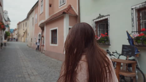 woman walking down a european street