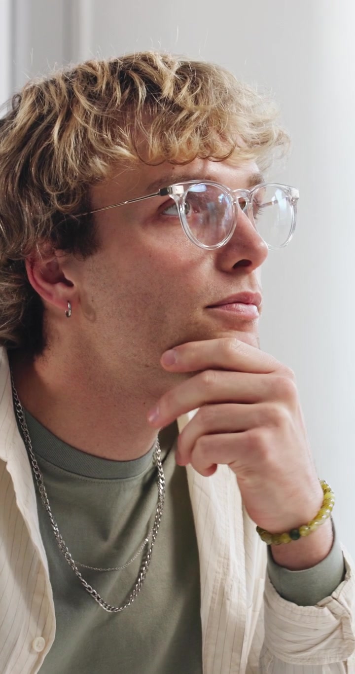 Young Man Thinking and Reflecting During a Conversation