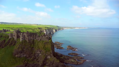 Aerial-shot-of-Dunluce-Castle,-in-Bushmills-on-the-North-County-Antrim-coast-in-Northern-Ireland