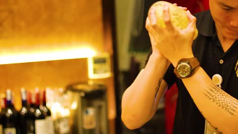 bartender expertly shakes cocktail in vibrant hanoi bar