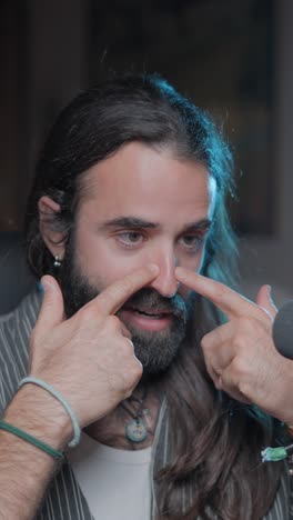 close-up of a man with long hair and beard