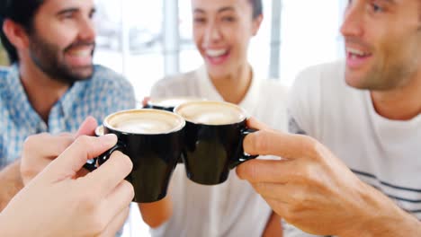 Happy-friends-toasting-their-coffee-