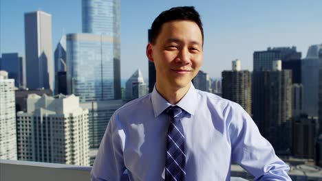 portrait of asian business consultant on chicago rooftop