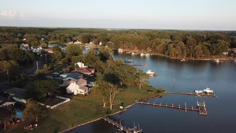 wooden boating docks and houses on shore of kent island, chesapeake bay, maryland usa