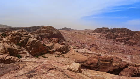 hot deserted landscape of dry sunny jordan, west asia. breathtaking scenery of rocky canyons from top of the sandstone.