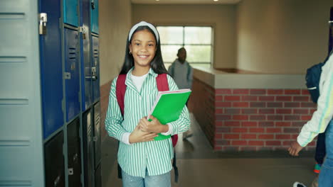 school students in the hallway by the lockers