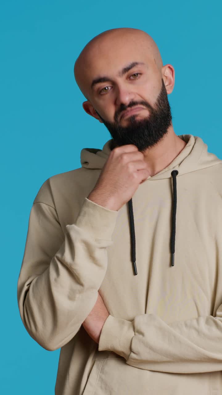 Vertical Video Middle eastern person thinking about a thing on camera