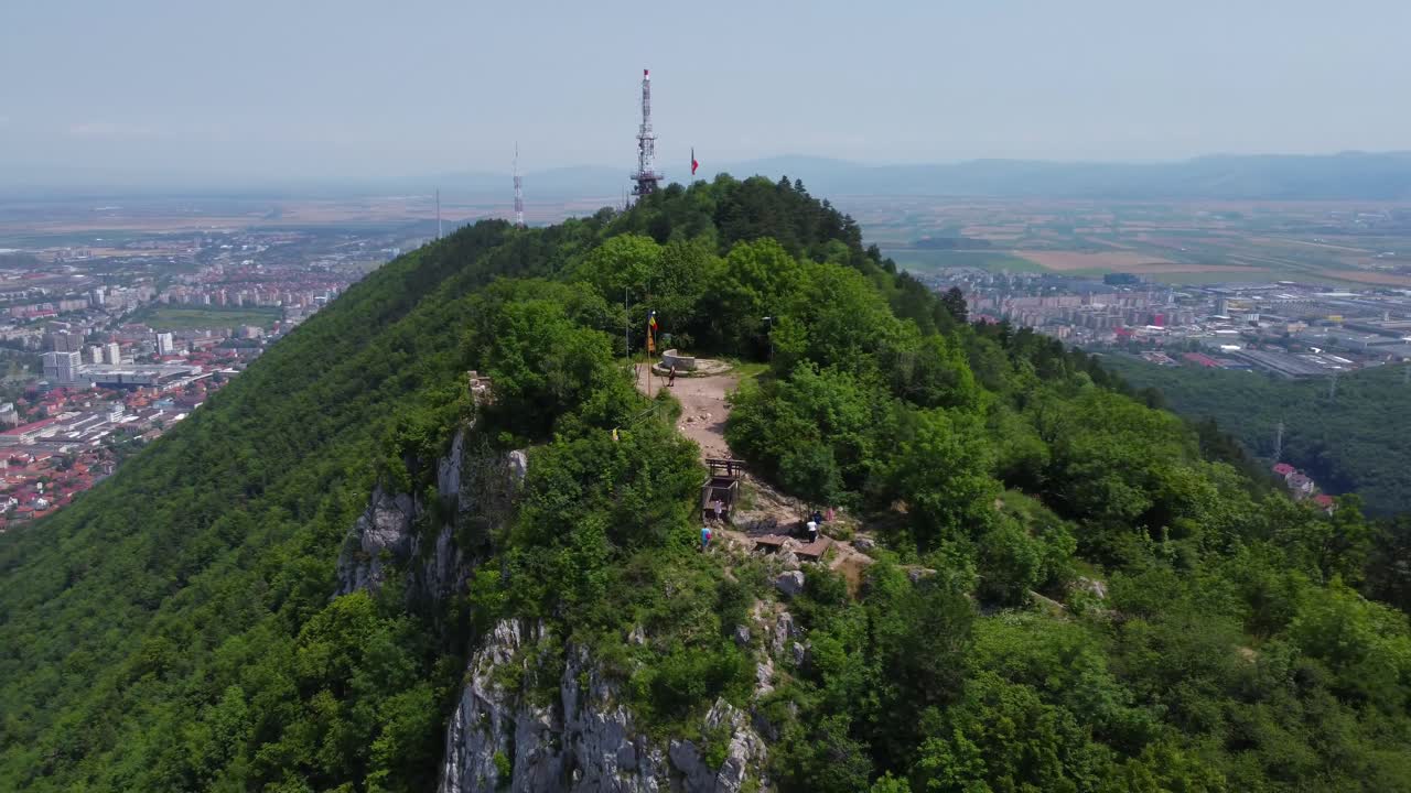 Cinematic panning of Mount Tâmpa and incredible views overlooking Brasov City Centre - Romania