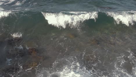 Top-down-shot-breaking-waves-in-slow-motion