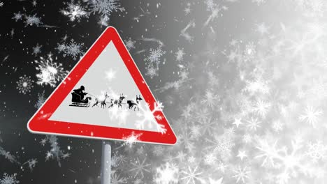 caída de nieve y señal de tráfico