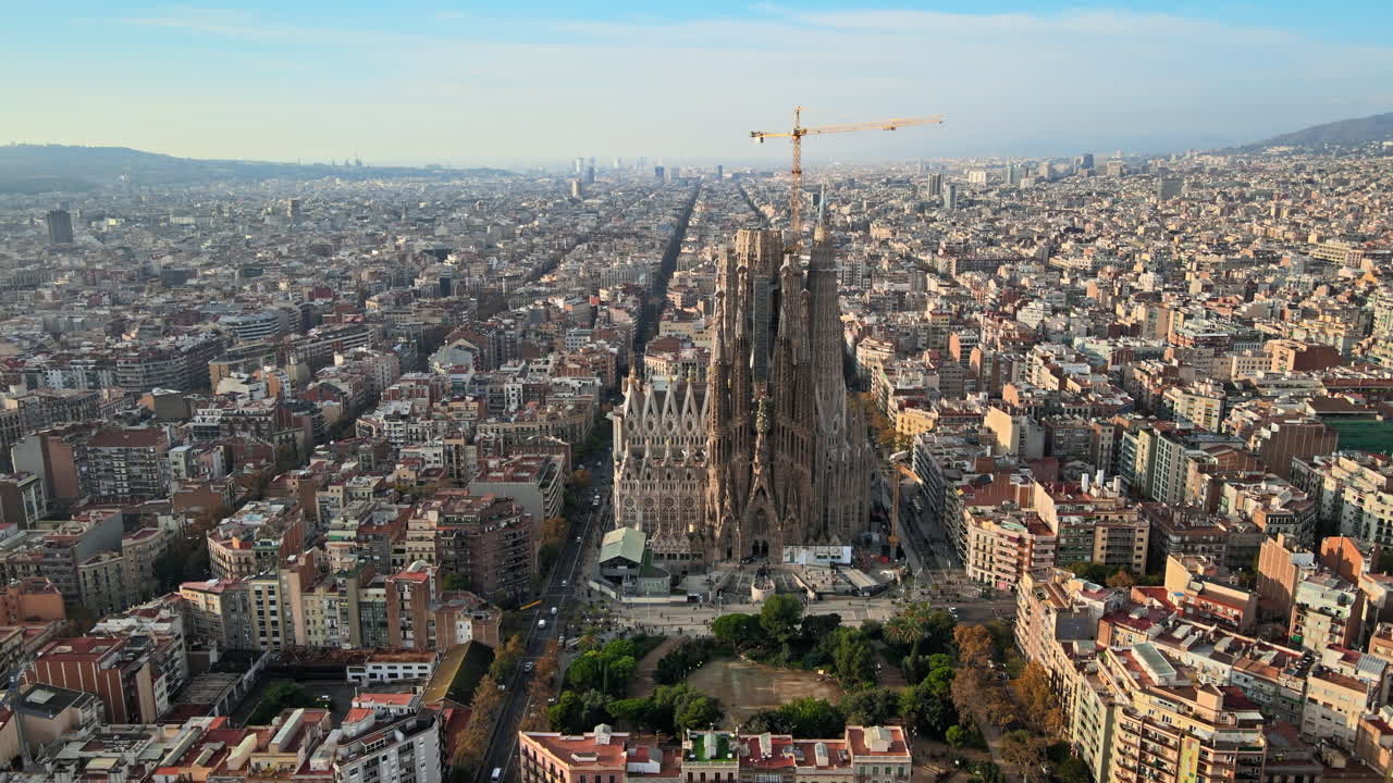 Aerial drone view of Barcelona, Spain. Blocks with multiple residential buildings and Sagrada Familia