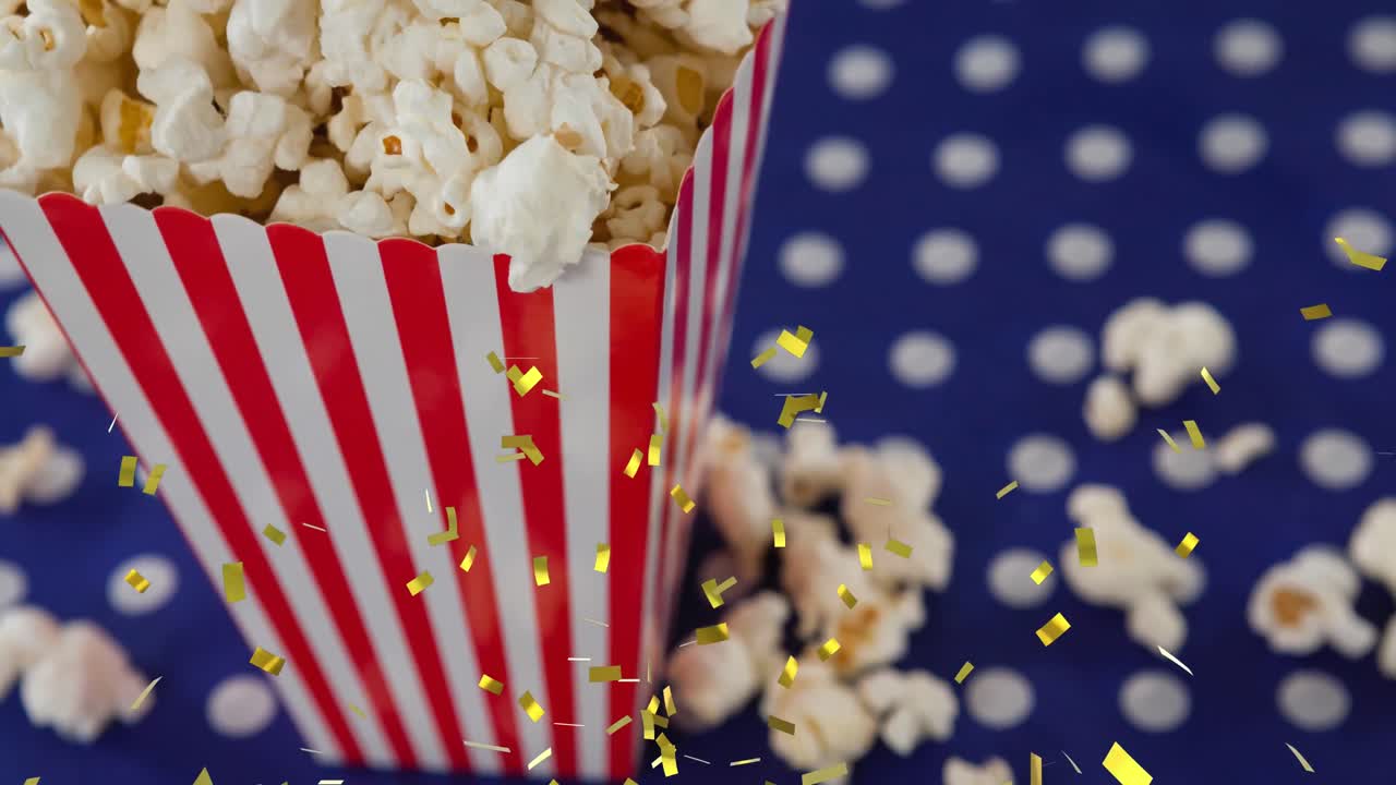 Animazione di coriandoli dorati su una scatola di popcorn