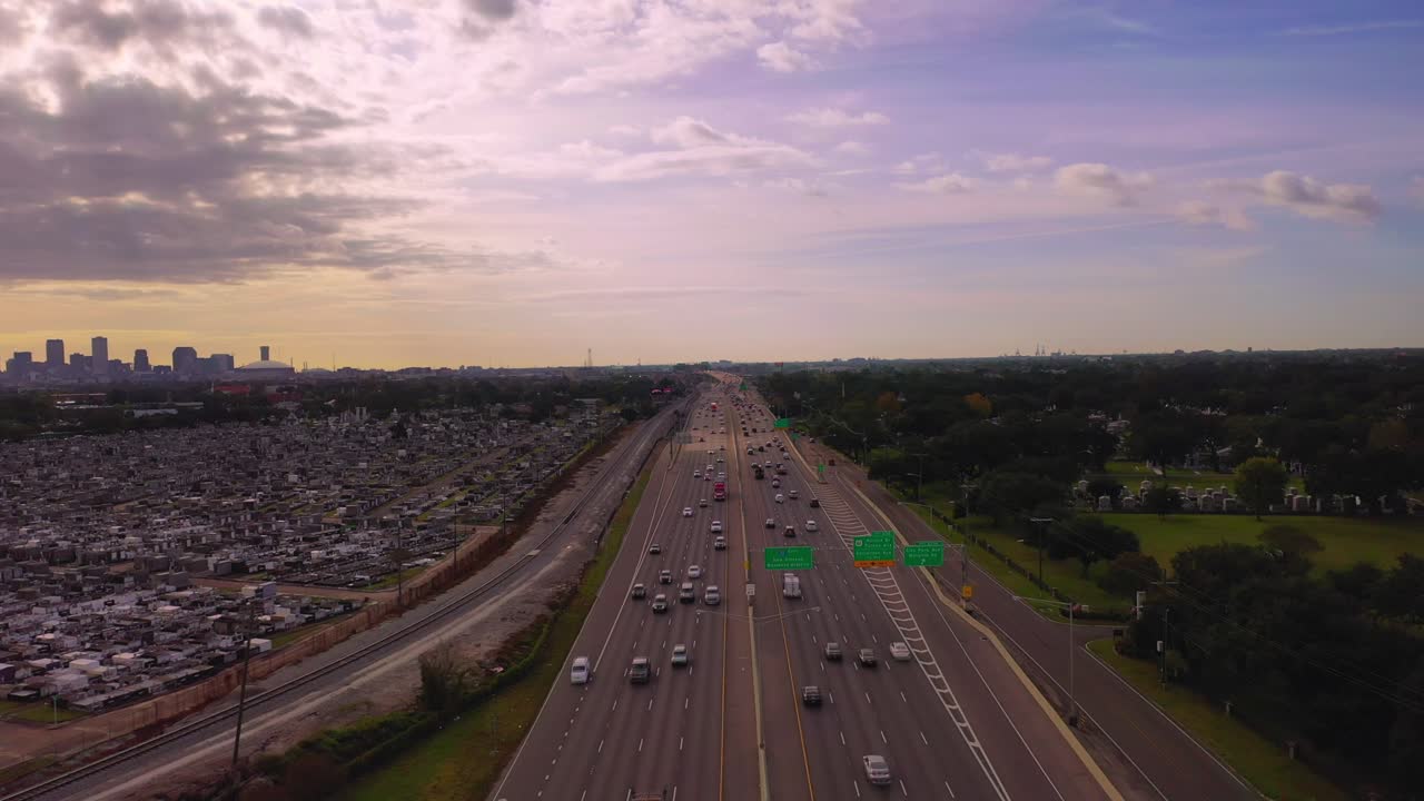 Aerial View of Highway and Cemeteries in New Orleans at Sunset