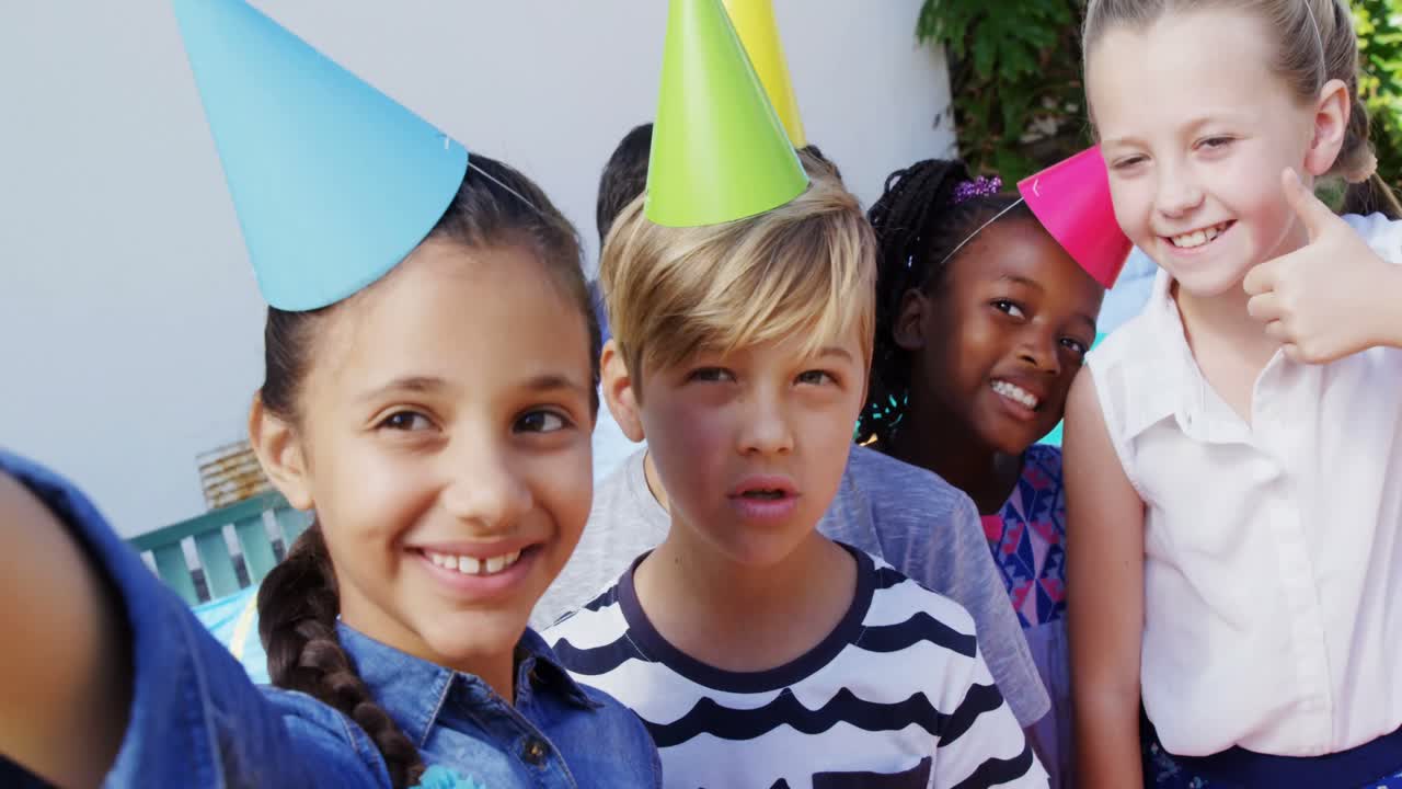 Kids taking selfies with mobile phone in the backyard of house 4k