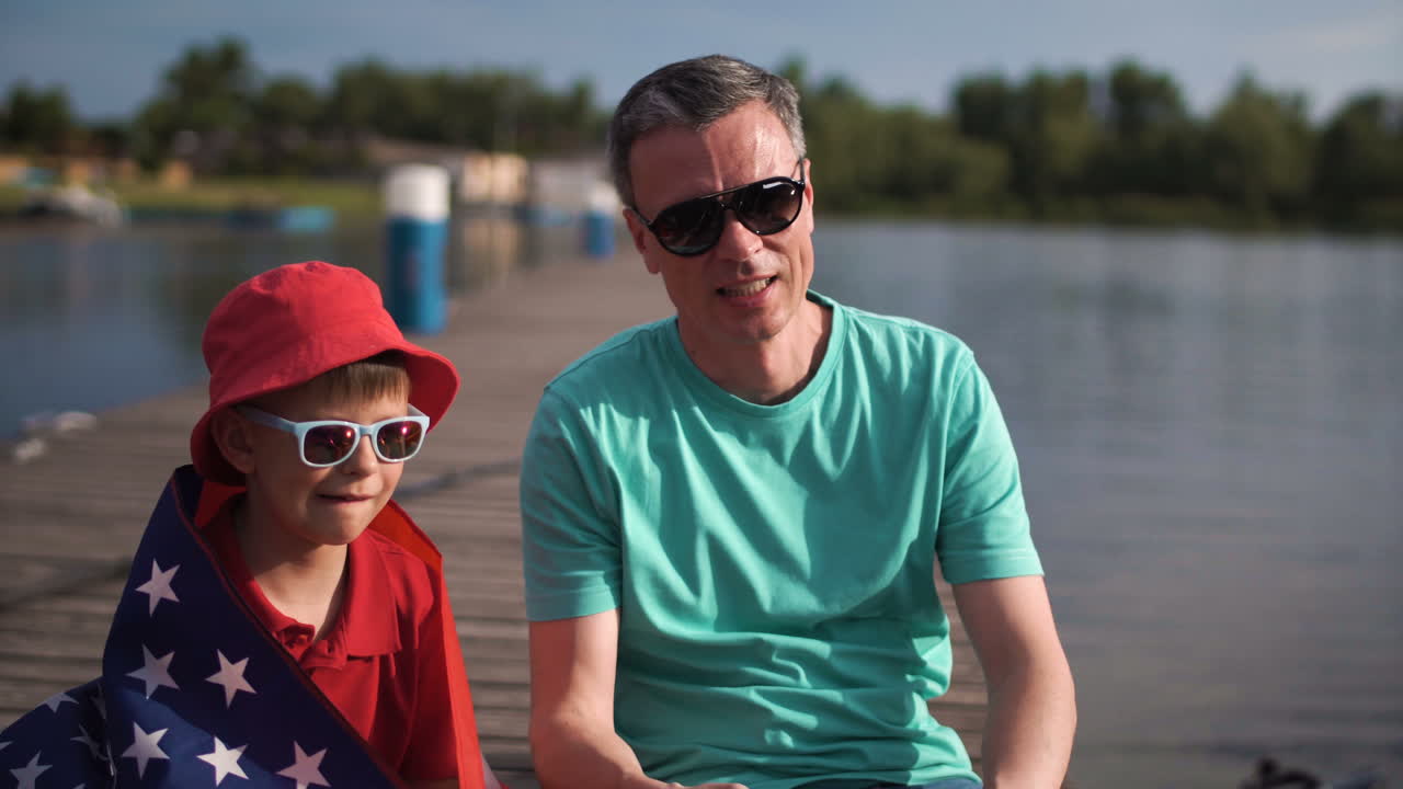 Father and Son Enjoying a Summer Day at the Lake