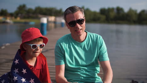 father and son enjoying a summer day at the lake