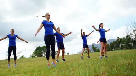 fit people performing stretching exercise 4k