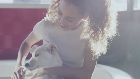 4k video footage of an attractive young woman bonding with her newly adopted dog at the animal shelter