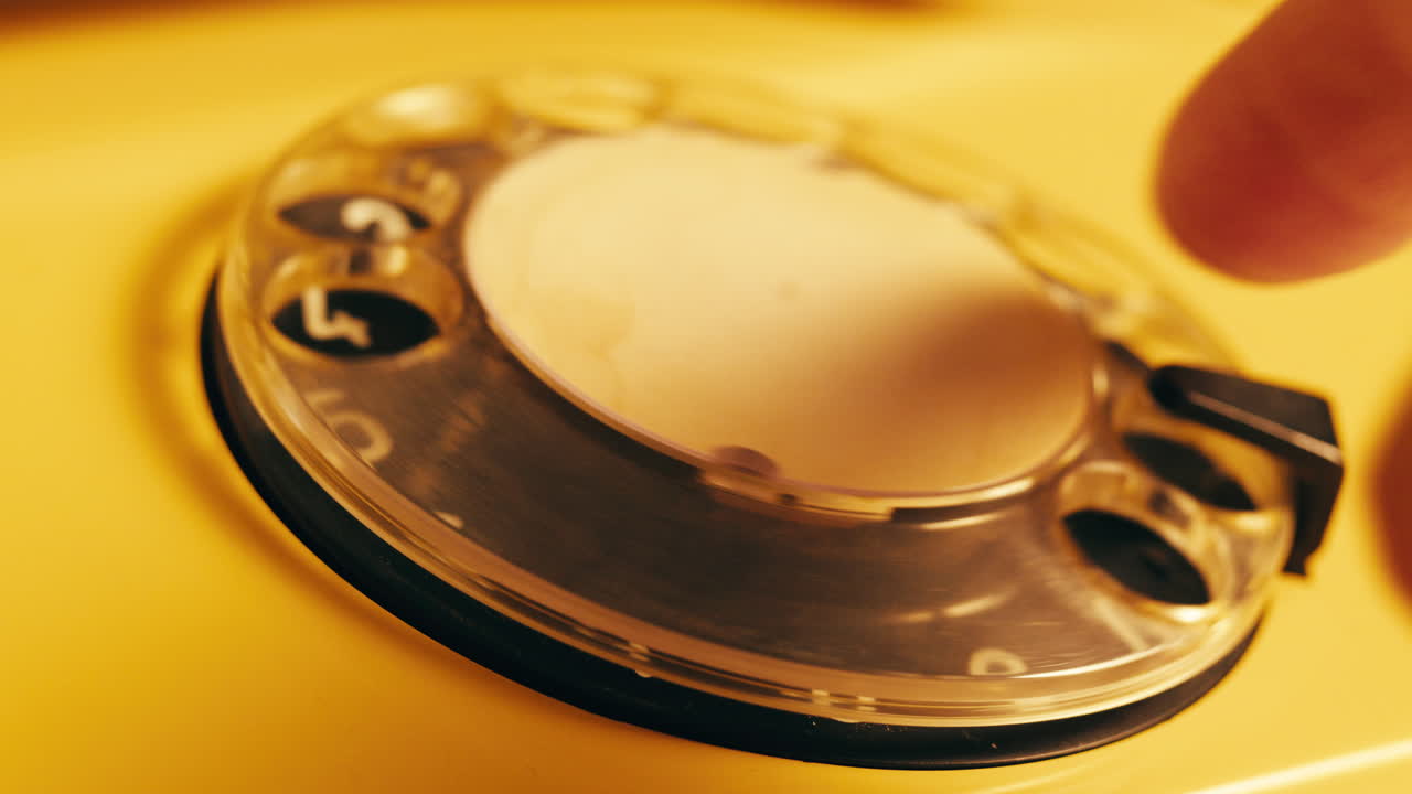 Retro vintage phone, A yellow rotary telephone is displayed on a wooden desk, adding a nostalgic touch