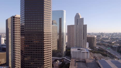 drone shot, houston texas usa downtown buildings, towers, skyscrapers and traffic on i-45 highway, gulf freeway