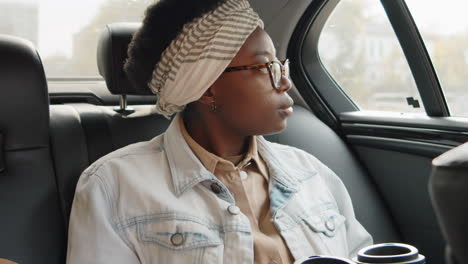 young african american woman riding in car