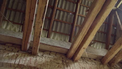 The-camera-slowly-slides-to-show-the-beams-of-the-old-barn