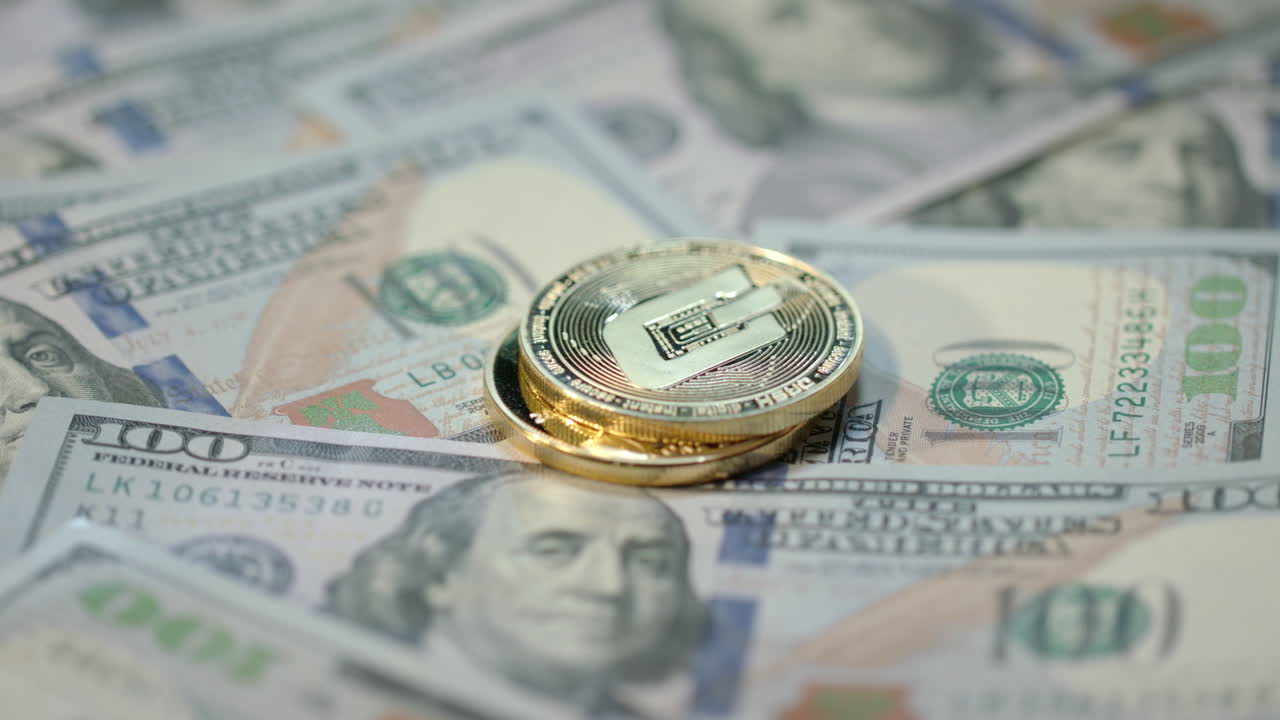 Human hand put gold bitcoin, dash and ethereum coins on dollar banknotes