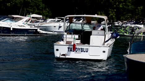 a boat docking at a marina in naples