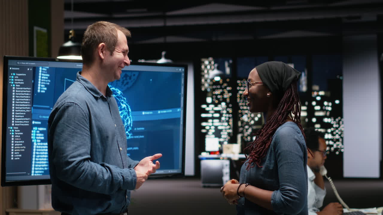 Happy Colleagues High-Fiving in a Modern Tech Office