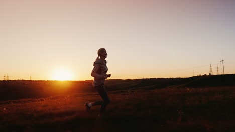 mom and daughter are racing in the sunset 2