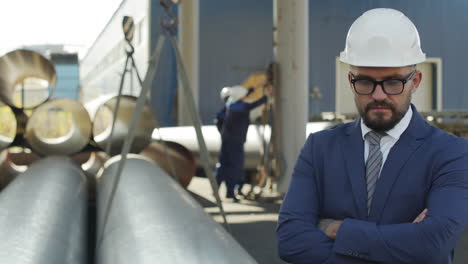 engineer in suit and hard hat in industrial workplace