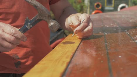 Securing timber plank with pins