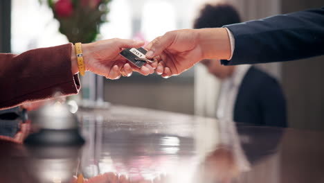 hotel reception with key exchange