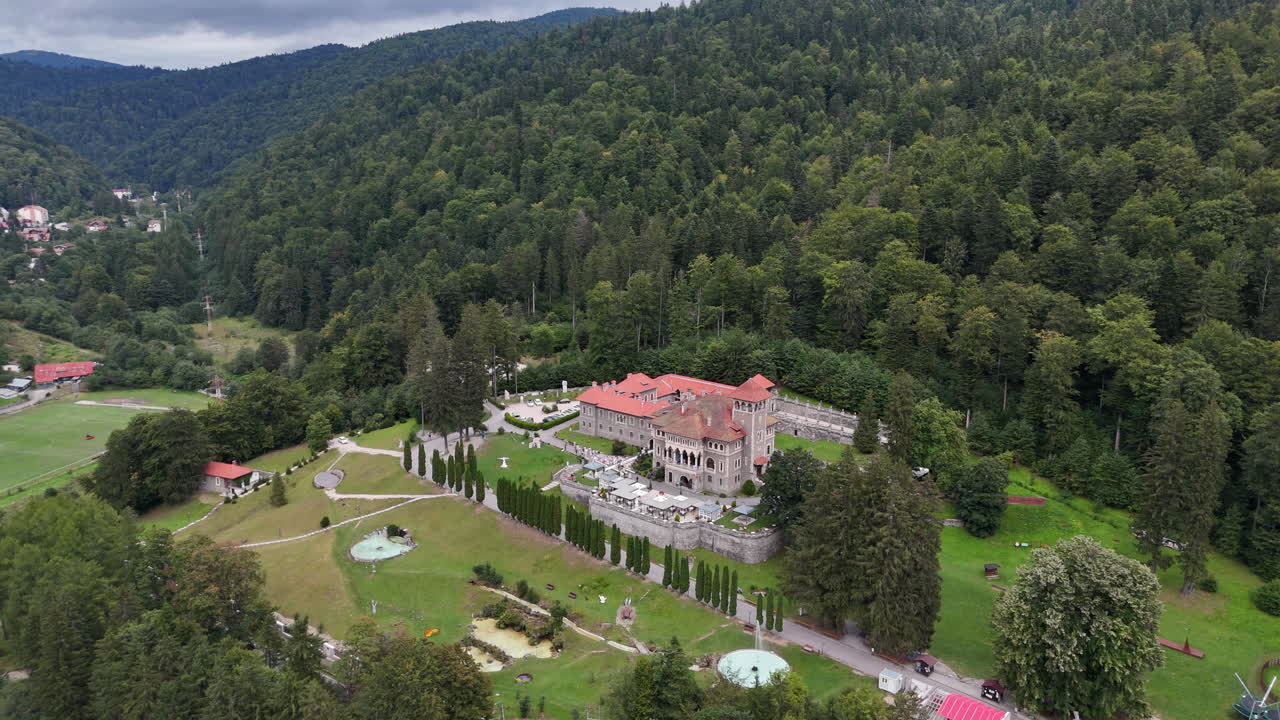 Aerial view of Cantacuzino Castle in lush Romanian landscape