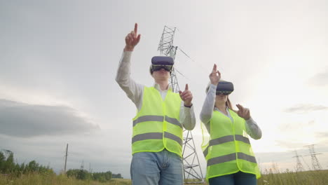 energy engineers use virtual reality glasses to control the solar panel system and deliver energy to consumers. engineers of the future.