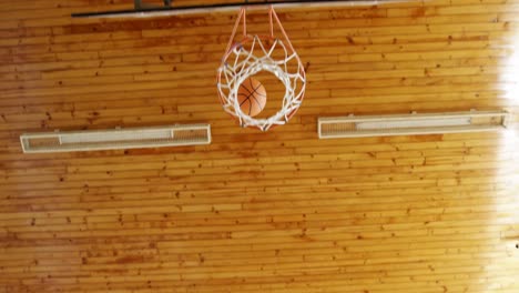 determined high school kids playing basketball