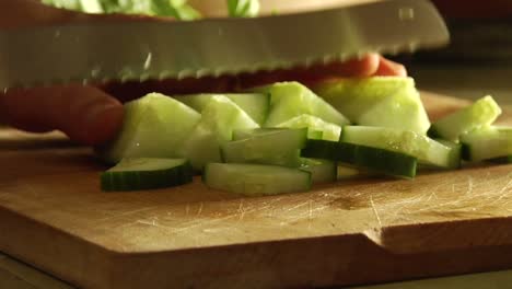 Hands-slice-cucumbers-with-a-knife