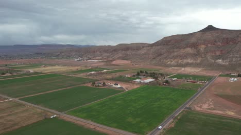 mollie's nipple butte above village in countryside of utah usa, drone aerial view