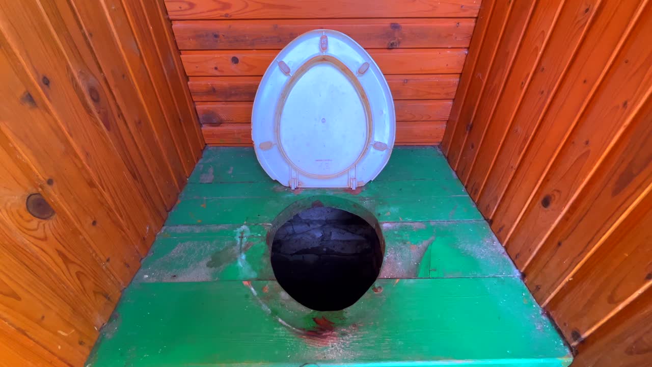 Close up of toilet seat of Russian composting toilet on the rural countryside