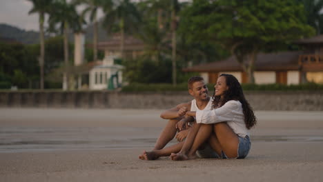 two friends talking at the beach