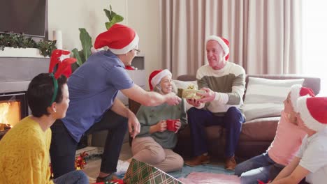 happy caucasian family giving presents at christmas