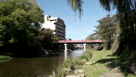 picturesque view beside miyagawa river with nakabashi bridge in background