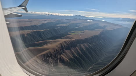 aerial view of mountains from an airplane window